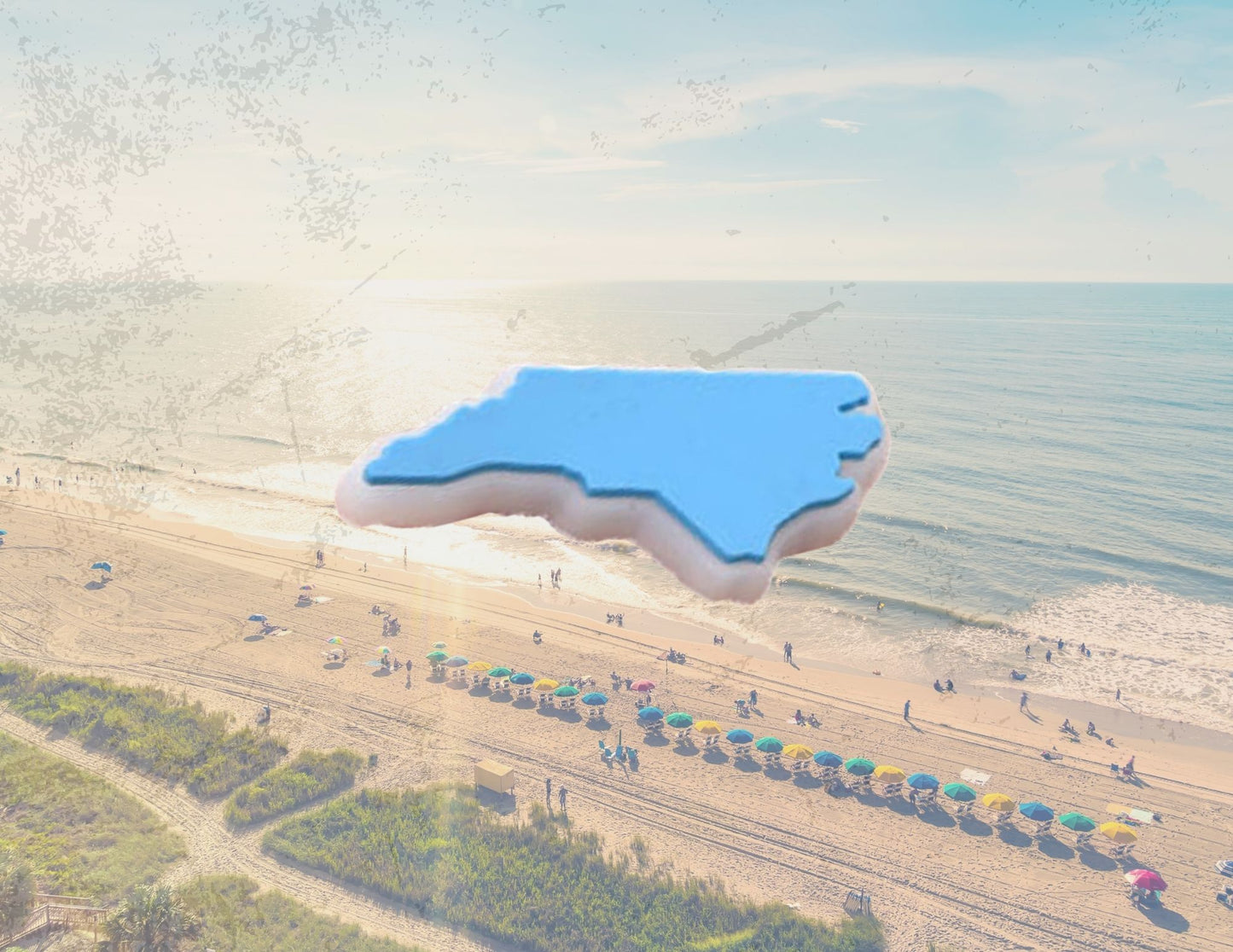 Malcontents North Carolina state Croc charm/Jibbitz: the shape of North Carolina in Carolina blue in front of Carolina coast background